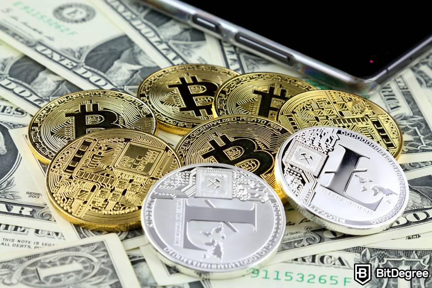 O que é negociação de criptomoedas usando um ombro de crédito: um monte de moedas físicas Bitcoin e Litecoin.
